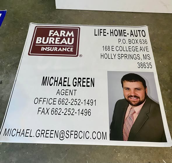 Large outdoor vinyl banner with vibrant graphics for business promotion